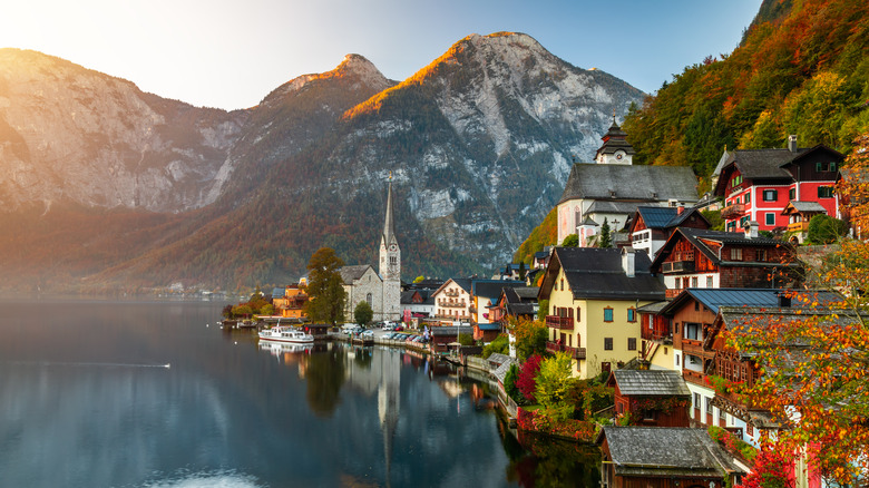 Lakeside city of Hallstatt, Austria at sunset with mountains in the background