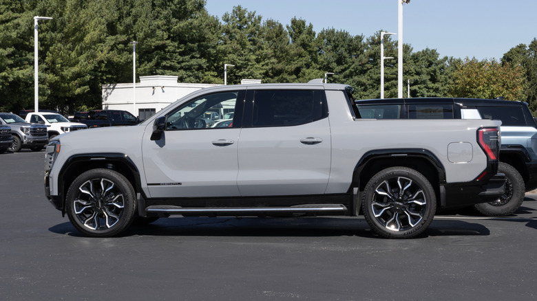 2026 GMC Sierra EV display at a dealership.