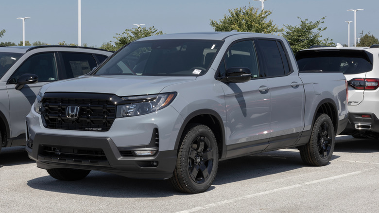 Honda Ridgeline AWD Black Edition pickup at a dealership.