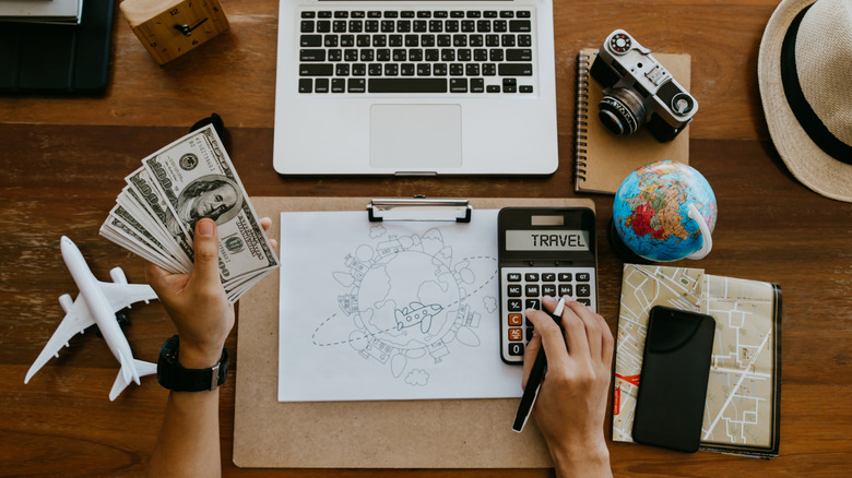 Person budgeting a vacation.