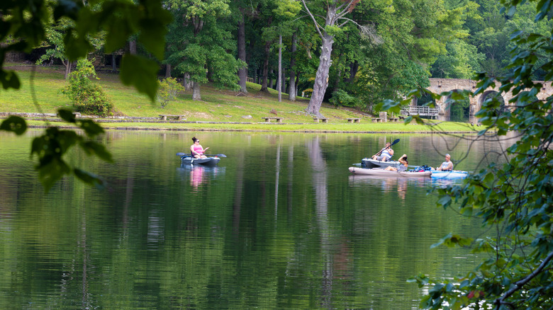 People boating in Bryd Lake at Cumberland Mountain State Park in Crossville Tennessee