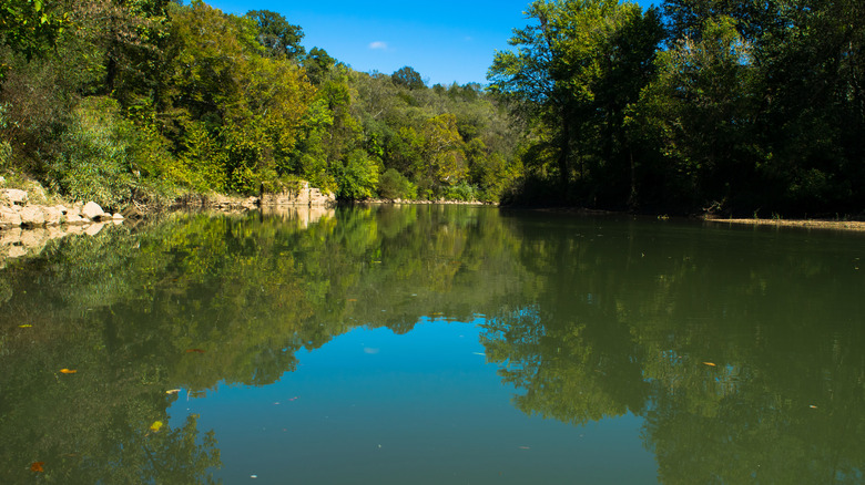 Blue sky reflected on Harpeth River in Kingston Springs Tennessee