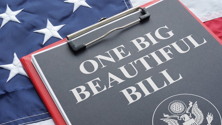 Clipboard featuring page with One Big Beautiful Bill and American flag in background