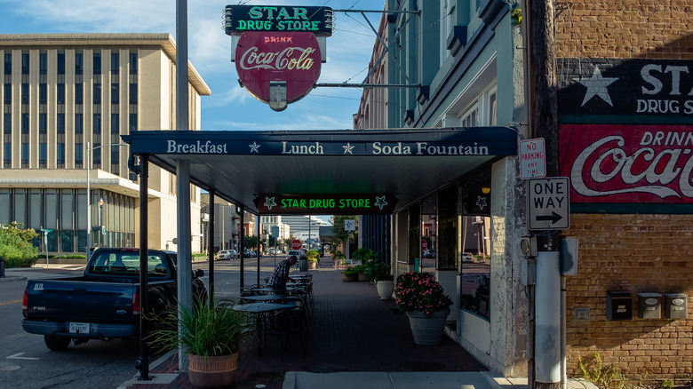coca-cola signs outside drug store in texas