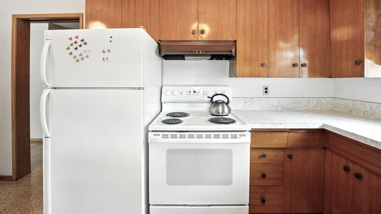 White stove and refrigerator in a kitchen