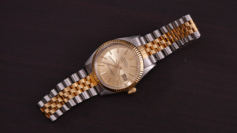 Rolex datejust 36 ref. 16013 on a wooden table