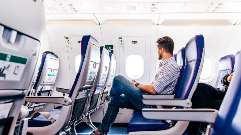 A man sitting on an airplane