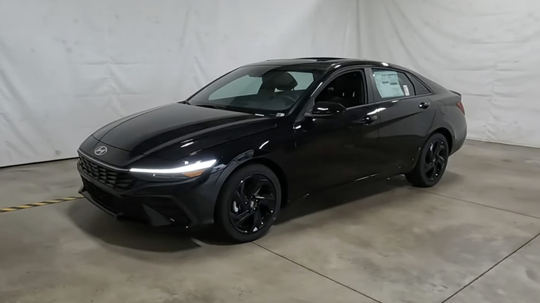A black 2026 Hyundai Elantra SEL Sport Plus on display in a dealership