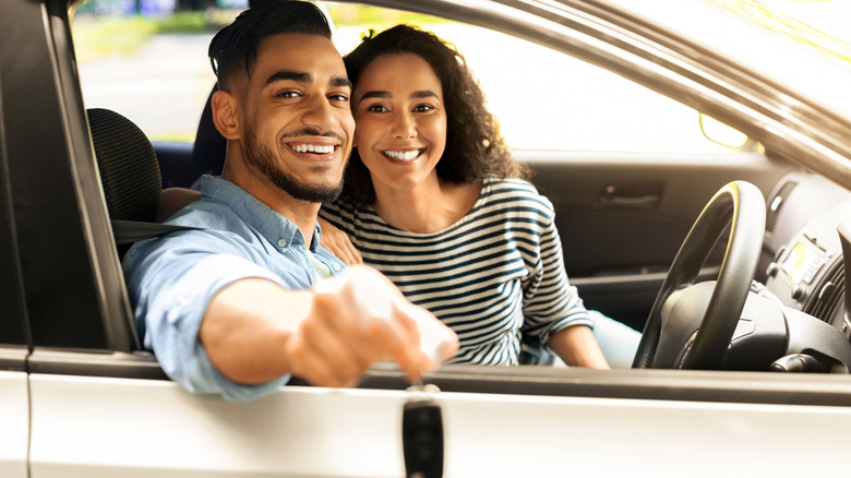 couple smiling in a car
