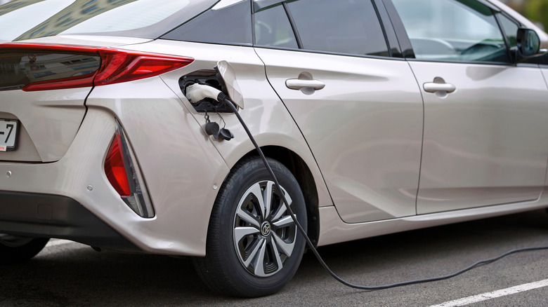 An electric vehicle being charged