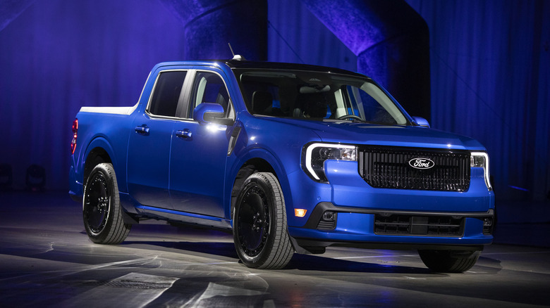 A 2025 Ford Maverick truck is shown at a Ford "Detroit Proud" event at the 2025 Detroit Auto Show.