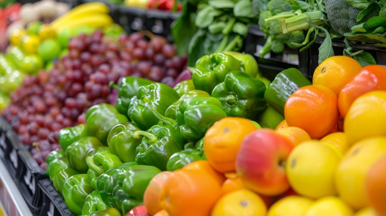 Fresh vegetables displayed in a produce aisle