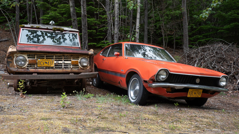Two classic Ford models in poor condition