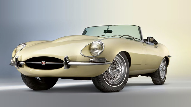 A yellow classic Jaguar convertible