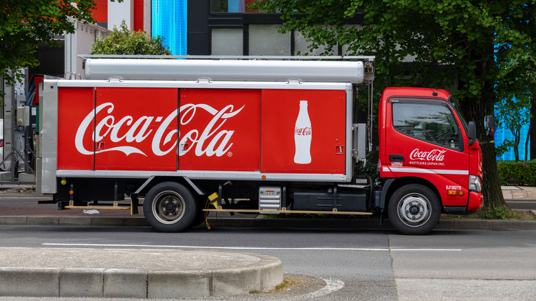 Sign for Coca-Cola on a delivery truck
