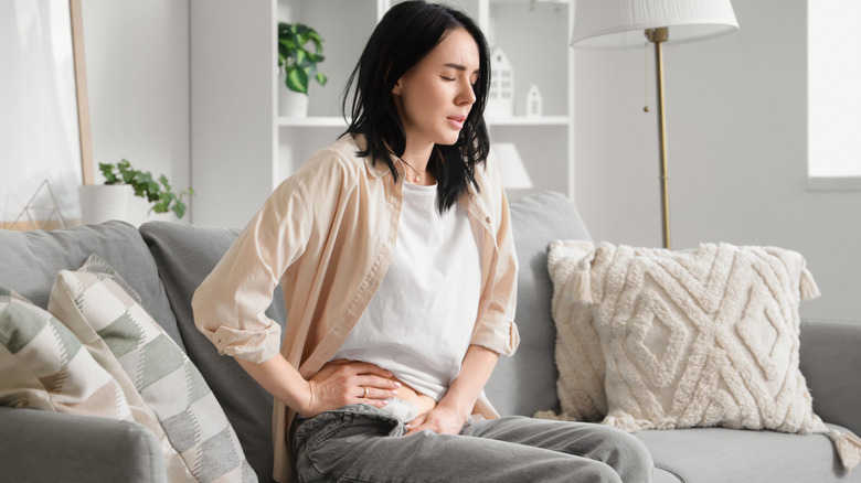 Woman with medical patch after appendectomy surgery