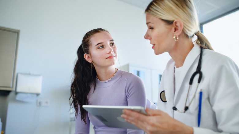 young woman seeing her doctor