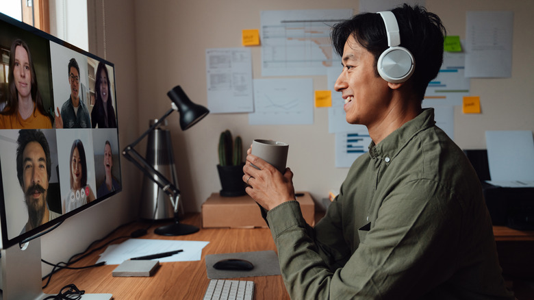 Man in a virtual meeting at home