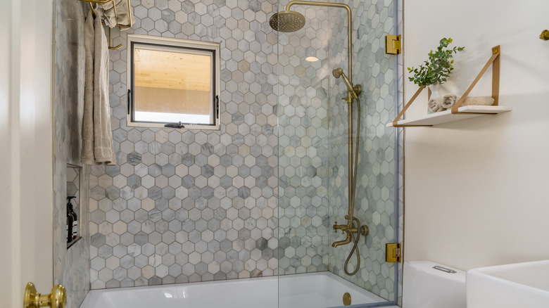 Tiled shower with transparent doors