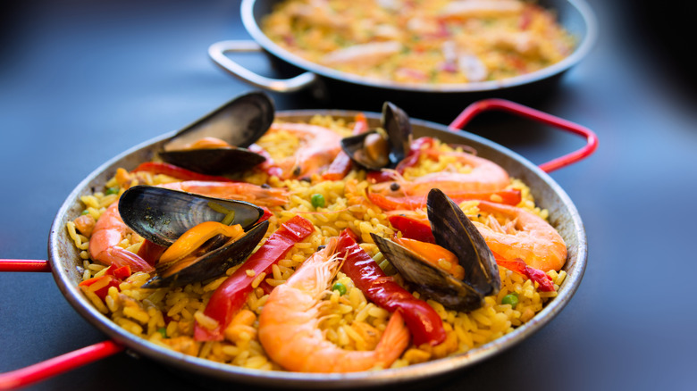 Spanish mini Paella tapas on black background
