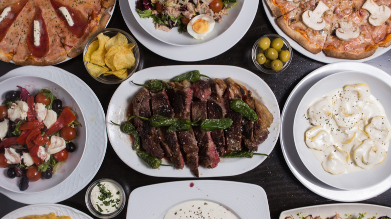 An overhead photo  of many different Spanish tapas foods,