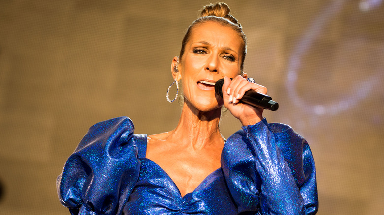 Celine Dion singing into a microphone