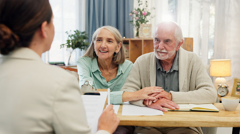 Older couple meeting with advisor.