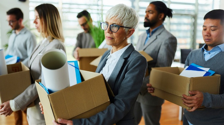 People leaving job with boxes