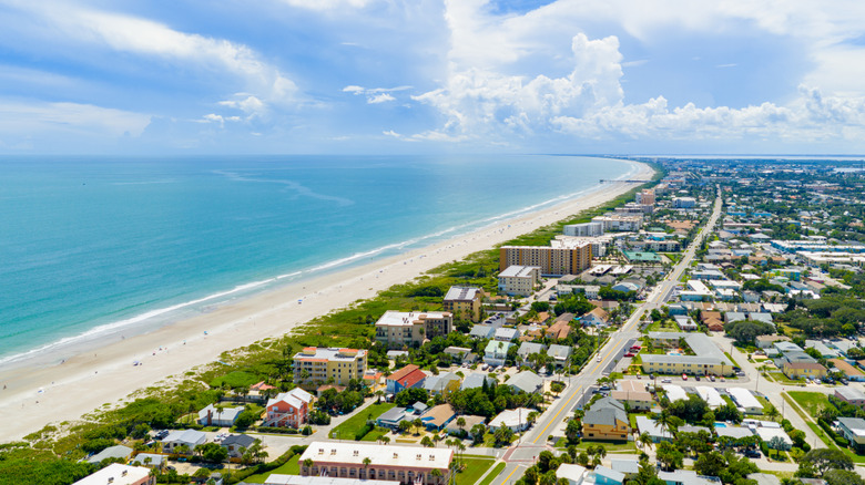 An aerial shot of a beach and neighborhood in Cape Canaveral, Florida