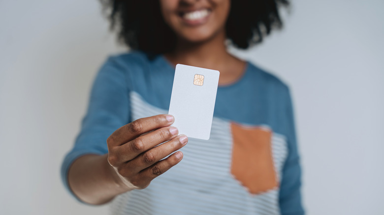 Woman holding credit card