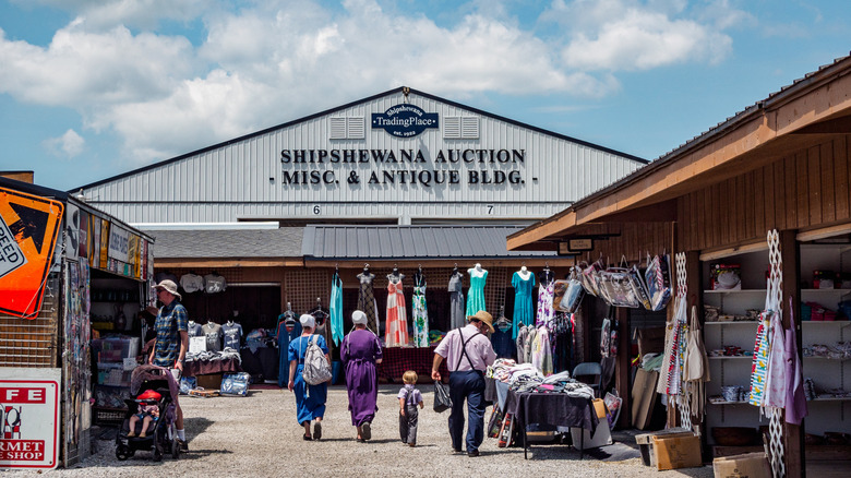An Amish family entering an antique building in Shipshewana Indiana.