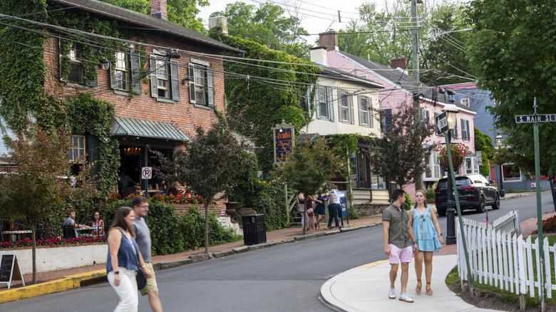 People walking through a residential neighborhood in New Hope, Pennsylvania, USA