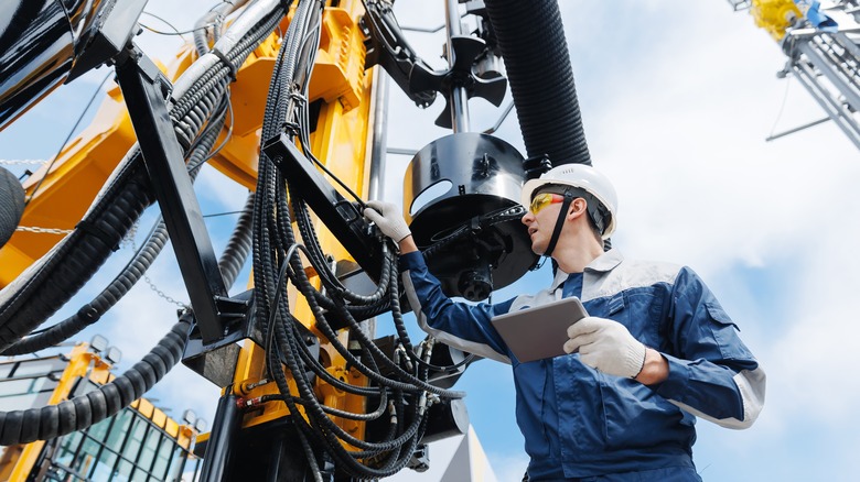 Oil drill worker with hard hat