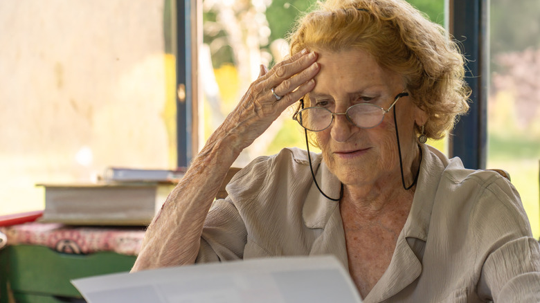 Senior woman worried about paying bills