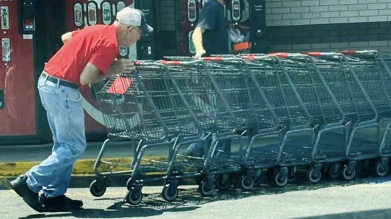 Grandfather Tom Mims pushing grocery carts at work