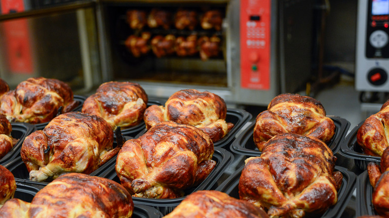 Rotisserie chickens prepped in store.