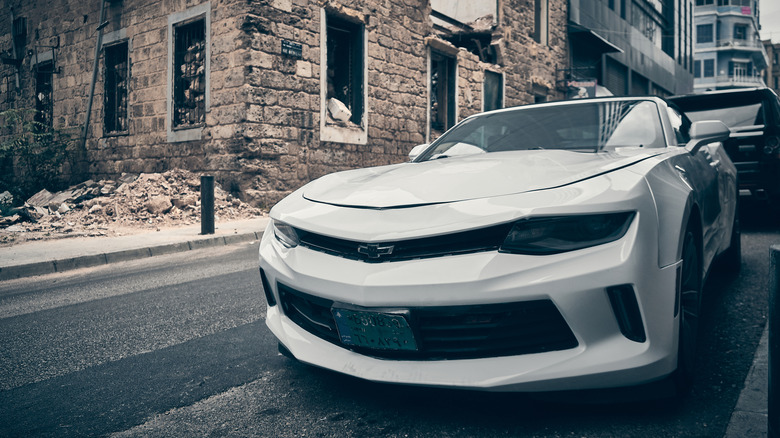 White Chevrolet Camaro parked on a residential street
