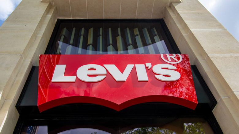 A Levi's sign in front of a store.