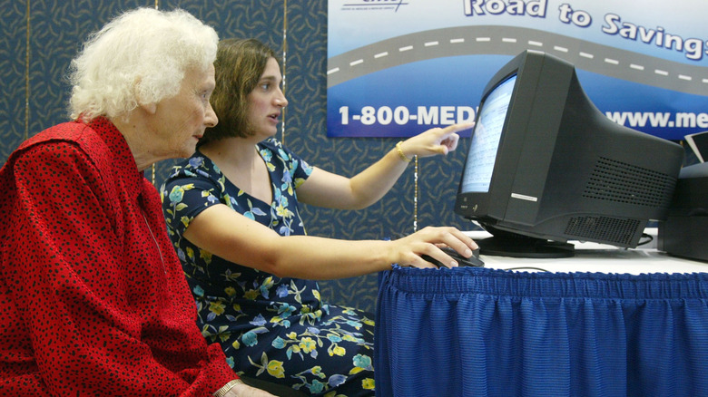 Young woman and senior woman looking at a computer screen