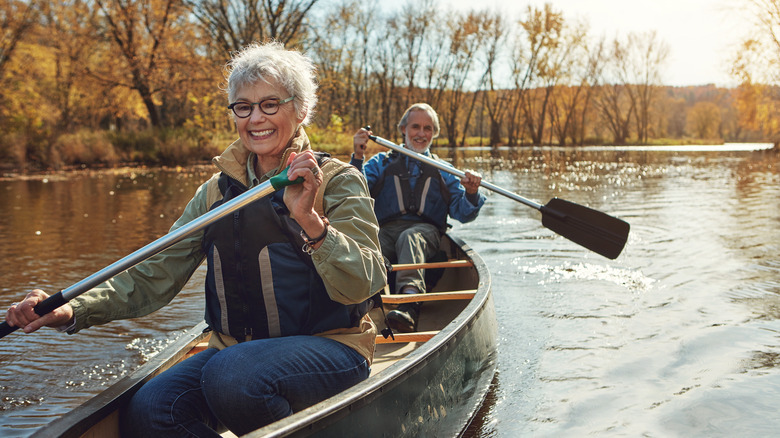 retired couple canoeing