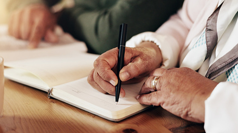 black pen laying on title page of a last will and testament