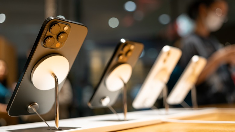 An Apple store with phones on display