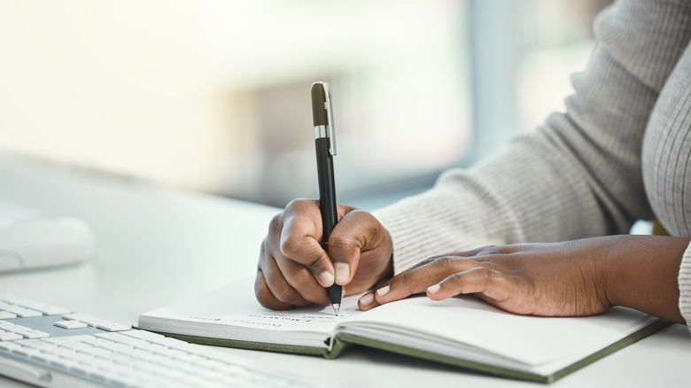 Closeup of a person taking notes
