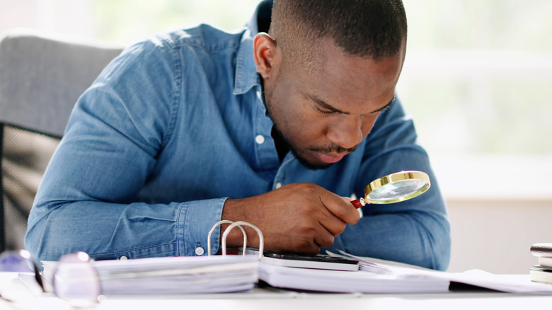 IRS agent auditing taxes with a magnifying glass
