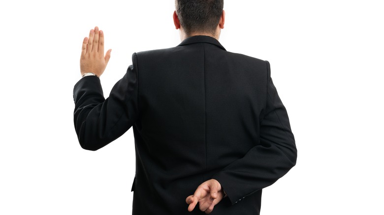 dishonest man taking an oath