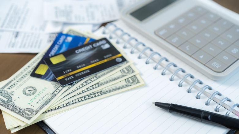 Cards, cash mixed expenses concept