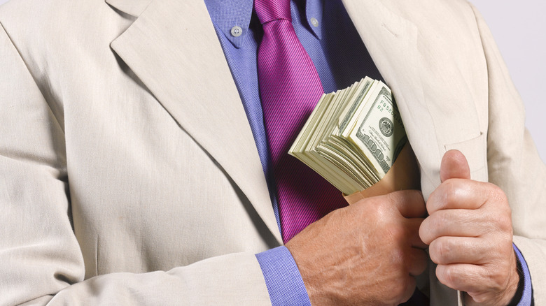 Man hiding away money