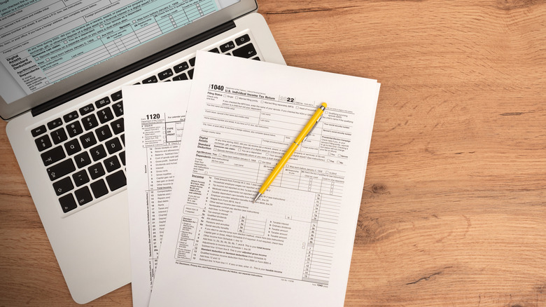 Paper income tax returns on a table