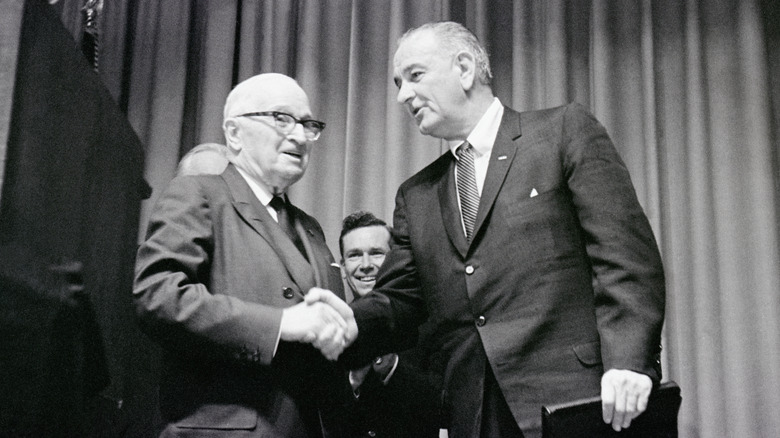 Black and white picture of two old men shaking hands