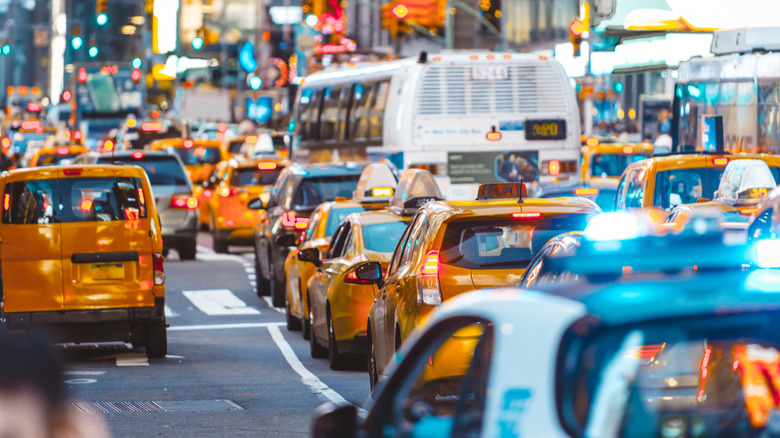 Urban jungle scene with cars and traffic in New York City.